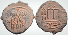 Phocas. (602-610 AD). Kyzikos 
AE Follis (34.4mm, 12.2 g,)
Obv: Phocas, holding globus cruciger, and Leontia, holding cruciform scepter, standing faci...