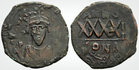 Byzantine 
Phocas (602-610 AD )Constantinople 
AE Follis (31.3mm, 11.3 g,)
Obv: DN FOCAS PЄRP AUC, Crowned bust facing, wearing consular robes, holdin...