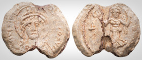 Byzantine Lead Seals Justinian I, (527-565)
Obverse: Draped nimbate facing bust of Justinian I, wearing helmet with diadem and pendilia.
Back: Winged ...