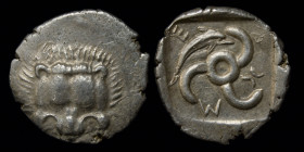 DYNASTS of LYCIA: Mithrapata (c. 390-370), AR Sixth Stater (Diobol). 1.2g, 13.6mm. 
Obv: Lion scalp facing. 
Rev: Triskeles; dolphin in one section, l...