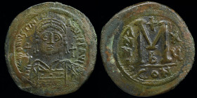 Justinian I (527-565) AE follis, issued 541/2 (year 15). Constantinople, 23.30g, 39mm. 
Obv: D N IVSTINIANVS P P AVI; Diademed, helmeted and cuirassed...