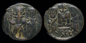 Constans II (641-668) AE Follis. Syracuse, 4.53g, 18mm.
Obv: Constans, holding long cross, and Constantine, holding globus cruciger, standing facing....