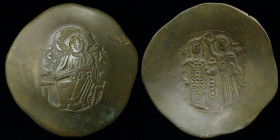 Manuel I (1143-1180) billon Aspron Trachy. Constantinople, 3.15g, 27mm. 
Obv: Christ enthroned facing, IC XC to either side.
Rev: Manuel standing faci...