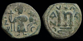 ARAB-BYZANTINE: Rashidun/Umayyad, AE fals, c. 650s-660s (transitional issue). 2.80g, 21mm.
Obv: Blundered “EN T૪TO” legend; Imperial figure standing f...