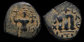 ARAB-BYZANTINE, Rashidun/Umayyad, AE fals, c. 650s-660s. 3.64g, 23mm.
Obv: Imperial figure standing facing, holding long cross and globus cruciger; ΛΙ...
