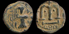 ARAB-BYZANTINE: Rashidun/Umayyad, Standing Emperor, c. 680-700, AE fals. “Pseudo-Damascus” mint, 2.46g, 19mm. 
Obv: Standing emperor holding long cros...