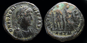 Honorius (393-423) AE3, issued 395-401. Antioch, 2.61g 20mm.
Obv: Pearl-diademed, draped, and cuirassed bust right
Rev: Emperor standing facing, head ...