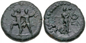 Pisidia, Etenna. 1st century B.C. AE 18 (17.8 mm, 4.71 g, 11 h). Two men standing side by side; the left brandishing double-axe, the right, a sickle /...