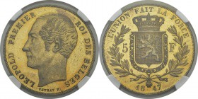 Belgique
 Léopold Ier (1831-1865)
 Epreuve en cuivre doré sur flan bruni du 5 francs - 1847 - Veyrat.
 Tranche inscrite.
 Rare.
 Flan Bruni - NGC...