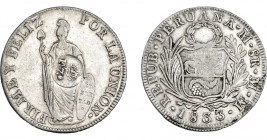 COLECCIÓN DE RESELLOS. FILIPINAS. 8 reales. Resello F 7º coronado sobre 8 reales 1833 Lima MM. KM-83. MBC+.