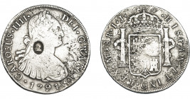 COLECCIÓN DE RESELLOS. GRAN BRETAÑA. Dólar. Resello busto de Jorge III dentro de óvalo sobre 8 reales 1791 Lima IJ. KM-638. La moneda BC+, con oxidaci...