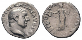 VITELLIUS. 69 AD.Rome mint. AR Denarius.A VITELLIVS GERM IMP AVG TR P: Head of Vitellius, laureate, right / LIBERTAS RESTITVTA: Libertas, draped, stan...