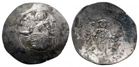 MANUELl I.(1143-1180). Constantinople.Billon Trachy. Nimbate and beardless bust of Christ facing, holding scroll and raising right hand / MANOVHΛ ΔECΠ...