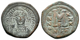 JUSTINIAN I.527-565 AD.Nicomedia mint.AE Follis.DN IVSTINIANVS PP AVG, helmeted, cuirassed bust facing, holding cross on globe and shield with horsema...