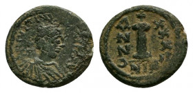 JUSTINIANUS I. (527 - 565). Decanummium. Nicomedia.Ae.

Obv: Bust with diadem, paludament and armor on the right.
Rev: Stamp I between ANNO and XXX II...