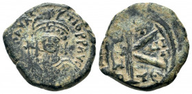 582-602 AD.Thessalonica.AE Half follis. DN MAVRC TIB PP AVG, helmeted and cuirassed or crowned and cuirassed bust facing, holding cross on globe, some...