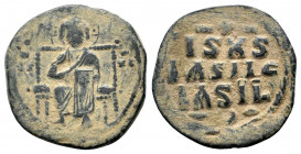 CONSTANTINE IX.1042-1055 AD.Class D Anonymous.AE follis. IC to left, XC to right of Christ, nimbate, seated facing on throne with back, holding book o...