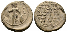 BYZANTINE LEAD SEAL.Circa 7 th - 12 th Century AD.PB Seal.Nimbate Saint George, standing facing, holding spear in his right hand and resting his left ...