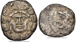 CILICIA. Uncertain mint. Ca. 4th century BC. AR obol (10mm, 9h). NGC XF. Head of Gorgoneion facing, coiled snakes around / Head of Athena left, with c...