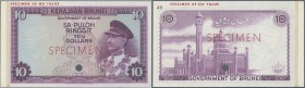 Brunei: 10 Ringgit ND Specimen Color Trial P. 3ct, one cancellation hole, specimen overprint, no serial numbers, left side still attached to piece of ...