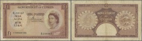 Cyprus: 1 Pound 1956 P. 35 in used condition with folds and creases, stained paper, minor border tears, condition: F.