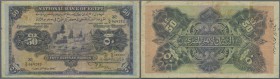 Egypt: Egypt: 50 Pounds 1945 P. 15d, used with stained but still strong paper, horizontal and vertical folds, ink writing at right border on back side...