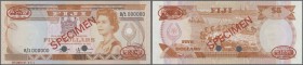 Fiji: 5 Dollars ND (1980) Specimen P. 78s with red ”Specimen” overprint at center, two cancellation holes and red De La Rue seals in corners. The note...
