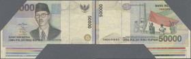 Indonesia: 50.000 Rupiah 1999, P.139a miscut, upper left part of the note is missing, but the lower frame of the paper sheet is still on the note. Rar...