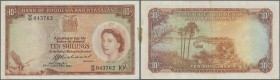 Rhodesia & Nyasaland: 10 Shillings 1961 P. 20b, light folds in paper, stain at right border, no holes or tears, still crispness in paper and nice colo...