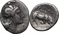 Greek Italy. Southern Lucania, Thurium. AR Triobol, c. 350-300 BC. Obv. Head of Athena right, wearing Attic helmet decorated with Scylla. Rev. Chargin...