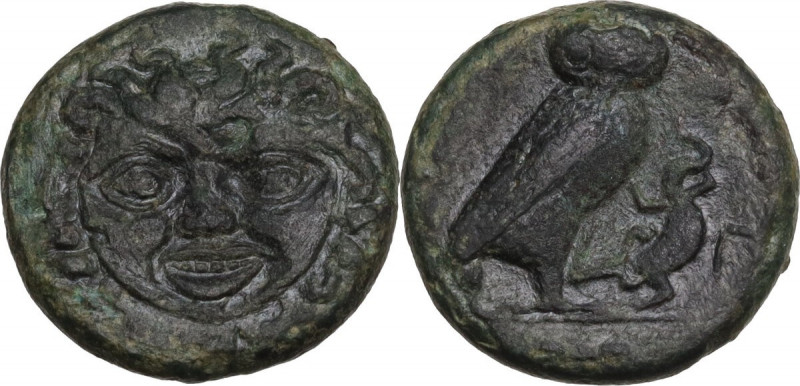 Sicily. Kamarina. AE Tetras, c. 420-405 BC. Obv. Gorgoneion. Rev. [KAMA] Owl sta...