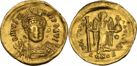 Justin I (518-527). AV Solidus, Constantinople mint. Obv. DN IVSTINVS PP AVG. Helmeted and cuirassed bust three-quarter face to right, holding spear a...