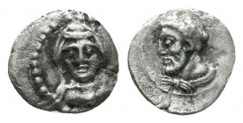 Greek Coins. Uncertain mints in Cilicia.
Obol, circa 400, AR. Head of Athena r., wearing crested Attic helmet. Rev. Baaltars with eagle, seated r. on ...