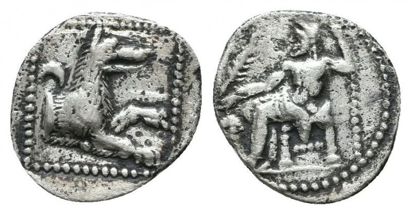 Lykaonia, Laranda AR Obol. Circa 324/3 BC. Baaltars seated left, holding grain e...