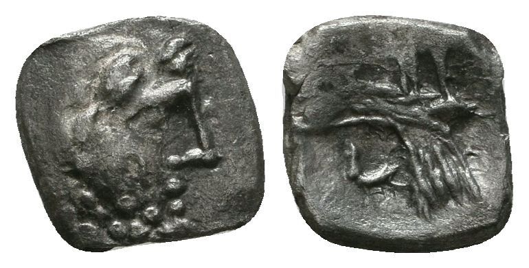 Lykaonia, Laranda AR Obol. Circa 324/3 BC. Baaltars seated left, holding grain e...