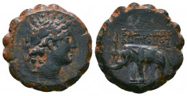 Seleukid Kingdom. Uncertain mint. Antiochos VI Dionysos 144-142 BC. Serrate Æ . Radiate head of Antiochus right, wreathed with ivy / BAΣIΛEΩΣ ANTIOXOY...