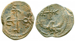 Byzantine lead seal of Leontios officer
(7th cent.)

Obverse: Eagle with open wings to right, invocative cruciform monogram over its head, resolved as...