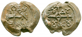 Byzantine lead seal of officer Nonnos son of Menas
(7th cent.)

Obverse: : Invocative cruciform monogram inscribed in the corners, resolved as, ΘΕΟΤΟΚ...
