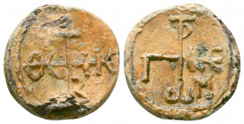 Byzantine lead seal of George comes
(7th cent.)

Obverse: : Invocative cruciform monogram, resolved as, ΘΕΟΤΟΚΕ ΒΟΗΘΕΙ (Mother of God, help), wreath b...