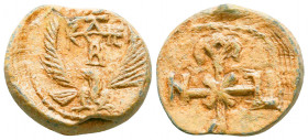 Byzantine lead seal of John honorary eparch
(7th cent.)
Obverse: Eagle with open wings to left, invocative cruciform monogram over its head resolved a...