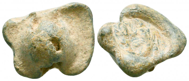 An early byzantine conical lead seal
(6th cent.)
Obverse: Possibly an eagle with...