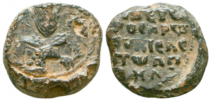 Byzantine lead seal of N. officer
(ca 11th cent.)
Obverse: Facial bust of a bish...