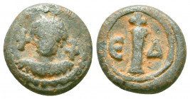 An uncertain mint byzantine lead coin of 10 nummi
(6th/7th cent.)
Obverse: Facial bust of the emperor, draped, wearing crown and pendilia, a cross in ...
