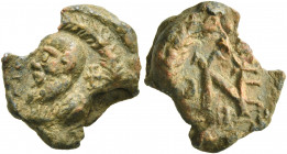 Eugenios, circa 550-650. Seal (Lead, 17 mm, 4.20 g). Bearded head (of Saint Paul?) to left, flanked by crosses, all in wreath. Rev. Block monogram of ...