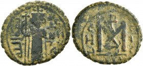 ISLAMIC, Umayyad Caliphate. temp. Mu'awiya I ibn Abi Sufyan, AH 41-60 / AD 661-680. Fals (Bronze, 21 mm, 4.17 g, 12 h), Arab-Byzantine type, Hims. Imp...