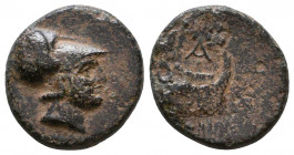 Kingdom of Macedon. Demetrios I Poliorketes. AE 11. 306-283 BC. (Newell-Demetrius 40). . Anv.: Helmeted head of Athena right. Rev.: Prow right, (aphla...