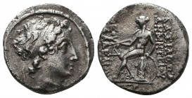 Seleukid Kings of Syria. Demetrios II AR Drachm. Antioch, Year 168 = 145 BC. Diademed head right / Apollo seated left on omphalos, holding arrow and b...