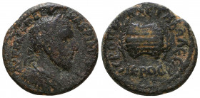 Cilicia, Hierapolis-Castabala. Macrinus. A.D. 217-218. Æ . Laureate, draped and cuirassed bust of Macrinus right / Agonistic urn between two palm bran...