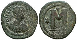 JUSTIN I. 518-527 AD. Æ Follis . Nicomedia mint, 2nd officina. Diademed, draped and cuirassed bust right / Large M, cross above; star left and right; ...