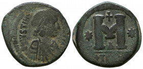 JUSTINIAN I. 527-565 AD. Æ Follis . Thessalonica mint. Struck 527-528 AD? Crude diademed, draped, and cuirassed bust right / Large M; cross above, sta...